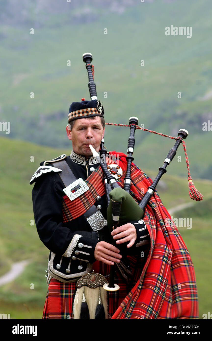 Scottish piper playing pipes Scotland Stock Photo