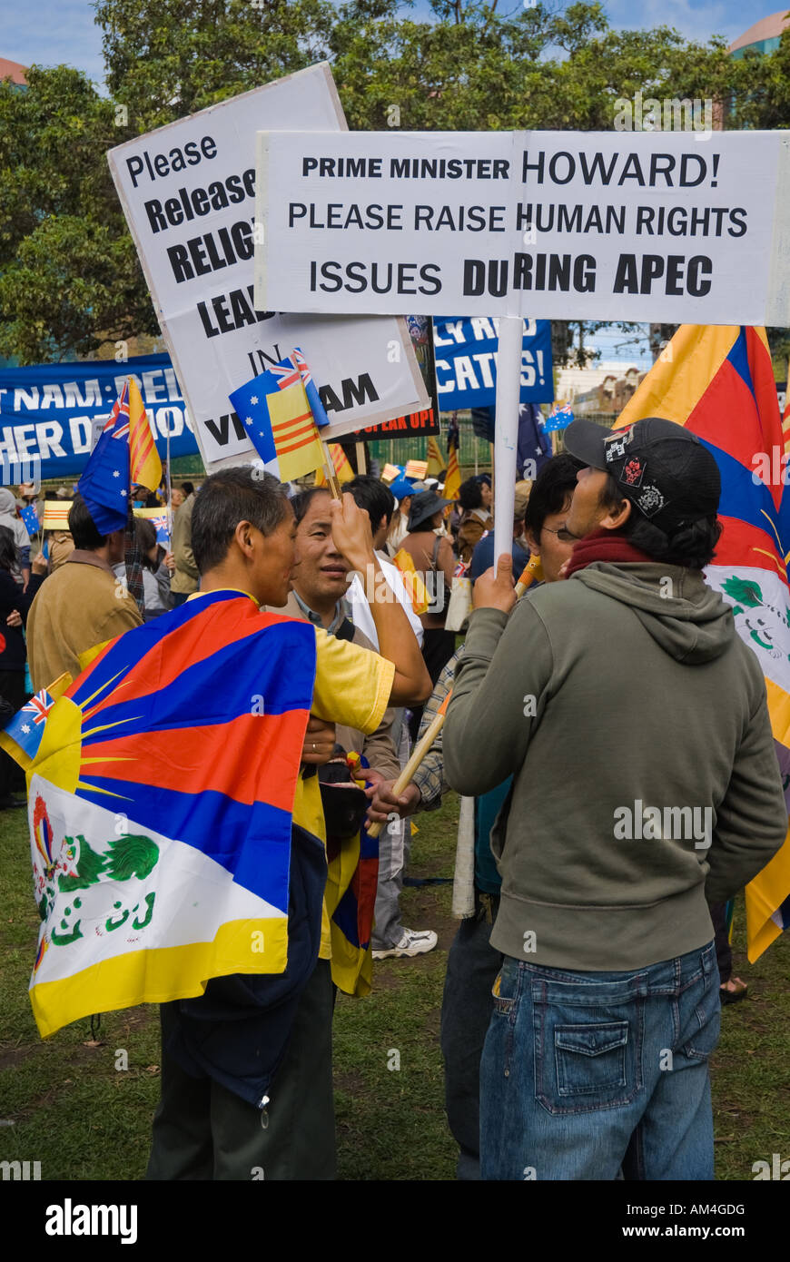 'Save Tibet' protesters on the occasion of the APEC summit in Sydney. Tibetan protest rally; flags; Tibetans holding placards; freedom; dissidents Stock Photo