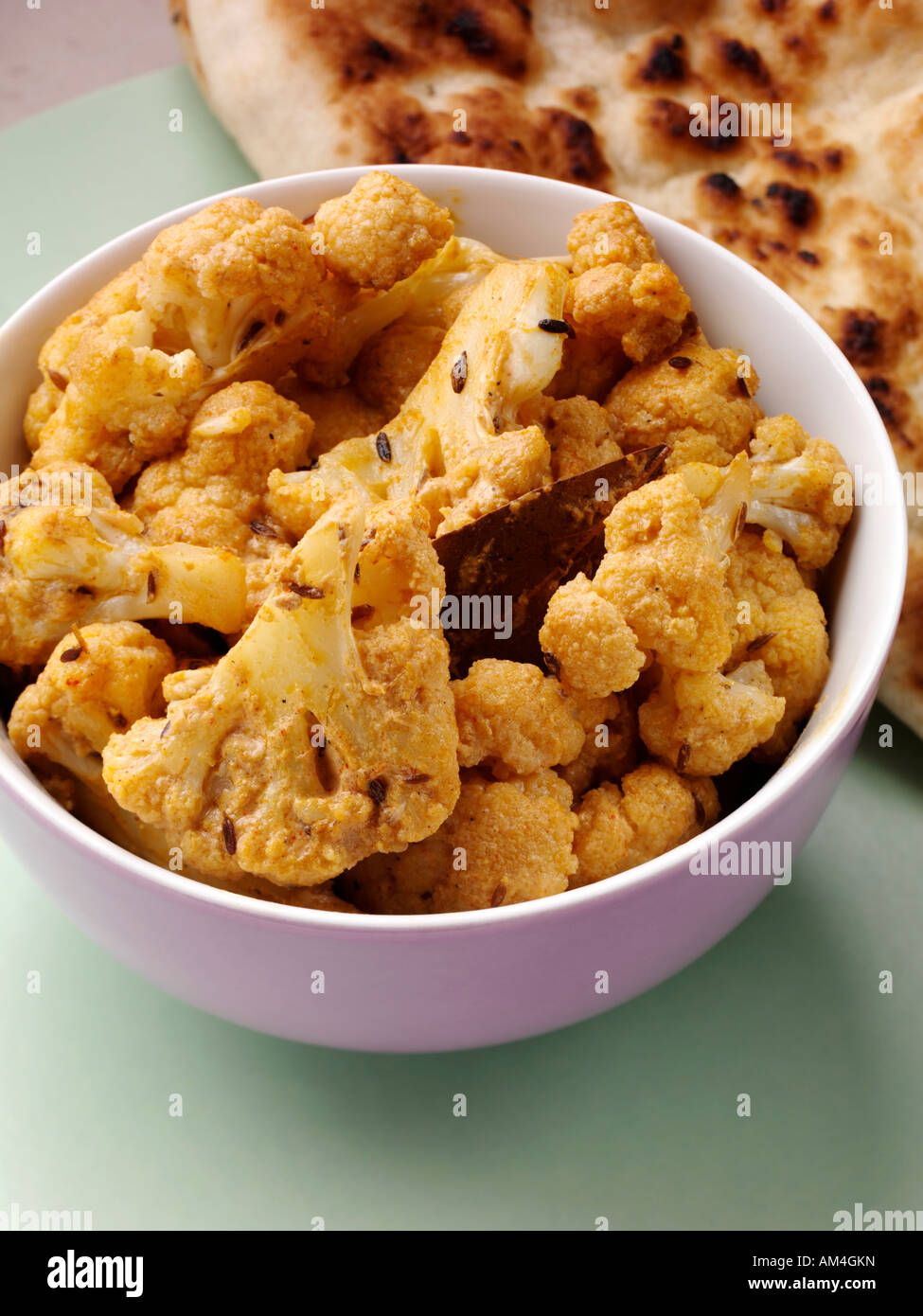Indian dry spicy cauliflower florets side order hires stock