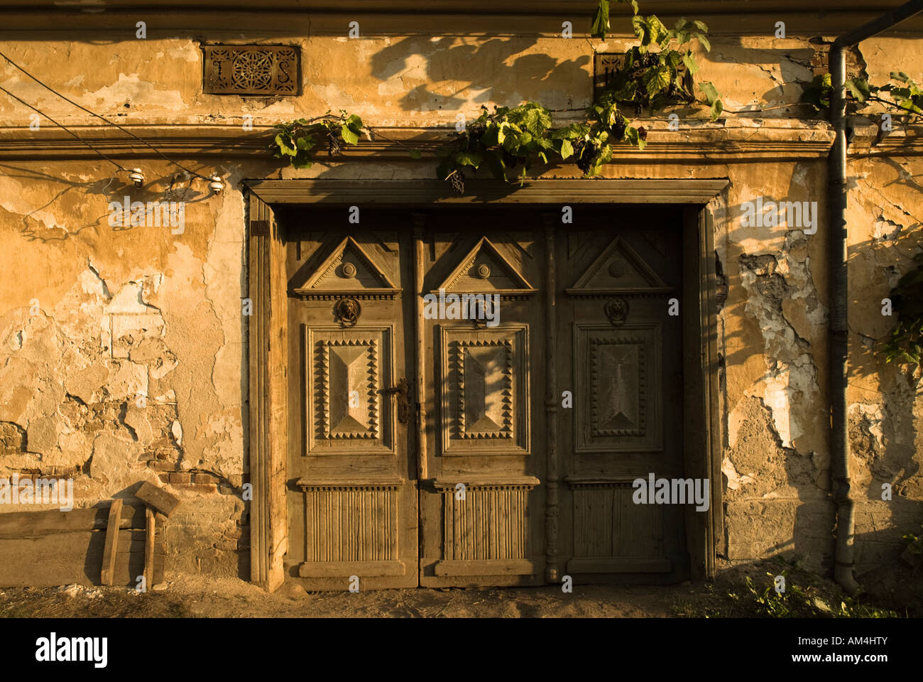 Traditional door and house, Romania Stock Photo