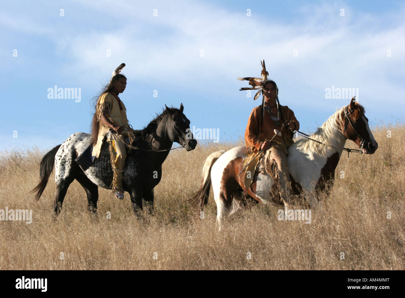 Two Native American Indian men on horseback scouting for enemies or ...