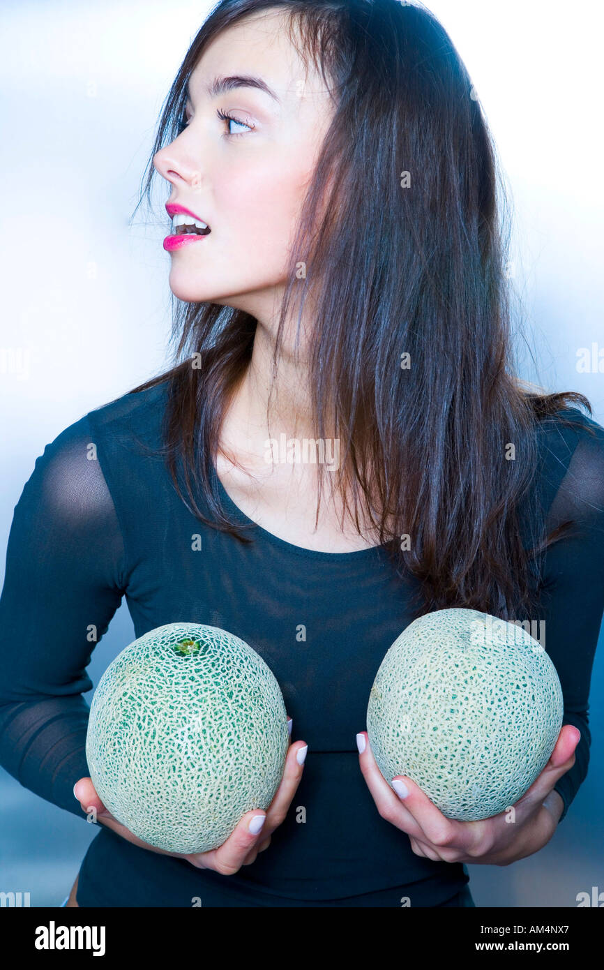 young woman with two melons Stock Photo Alamy