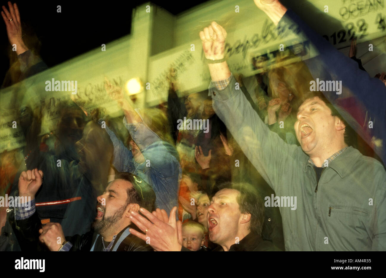 Fans cheer as cardiff ice hockey team score a goal in thier home stadium Stock Photo