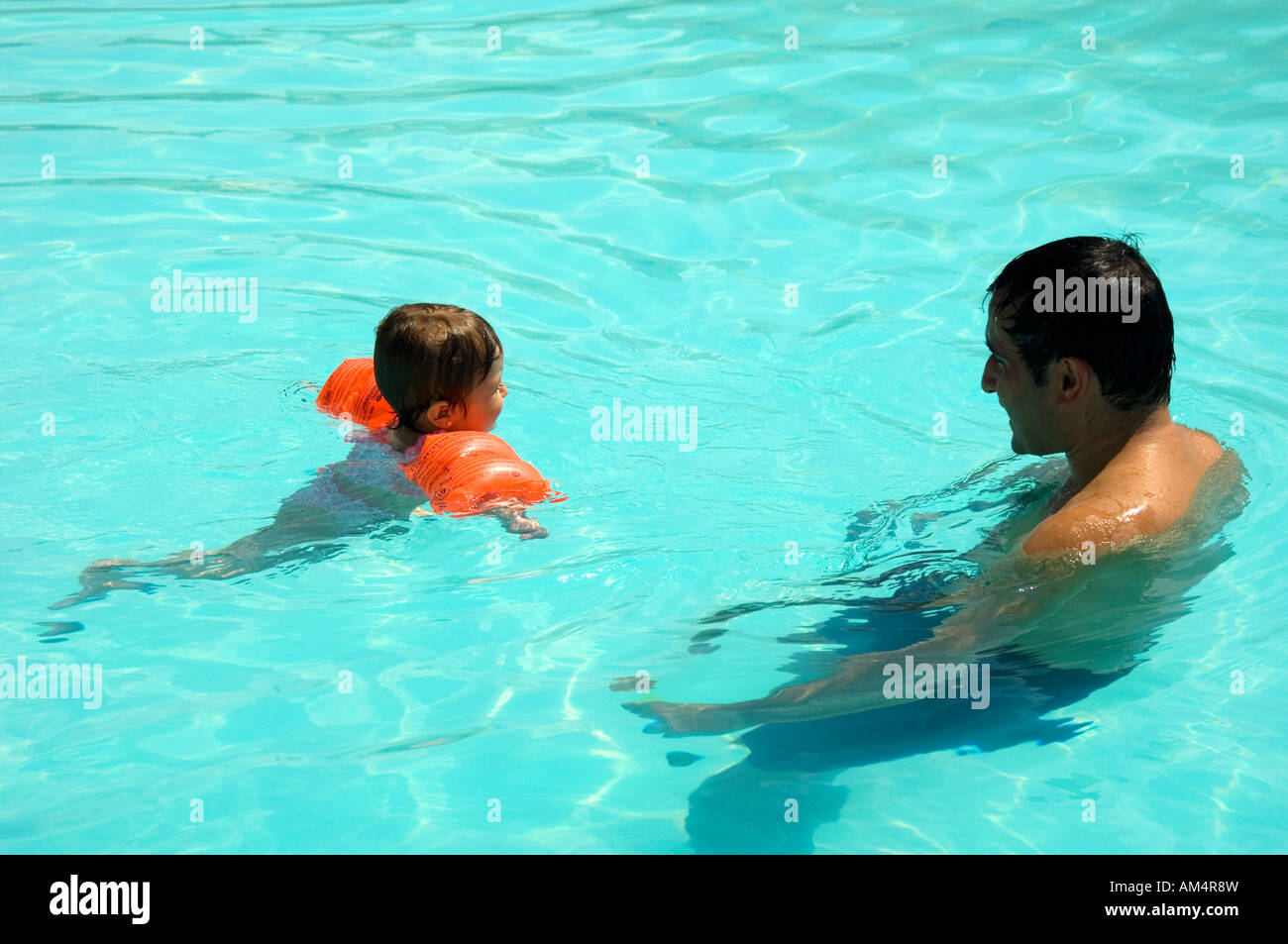 Father and daughter in swimming pool Stock Photo Alamy