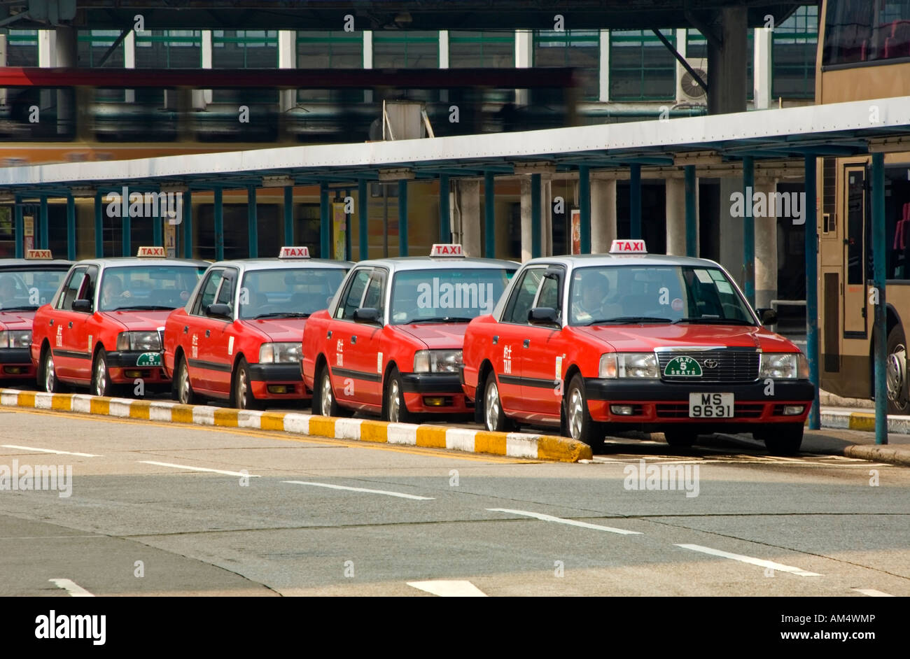 A Row of Hong Kong Taxis Waiting for Fares at the Central Bus Station, Kowloon, Hong Kong, China, Asia Stock Photo