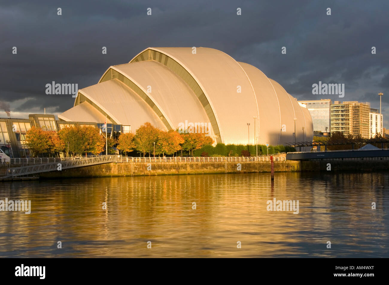 Evening Light Illuminates the Scottish Exhibition and Conference Centre and the River Clyde, Glasgow, Scotland, UK Stock Photo