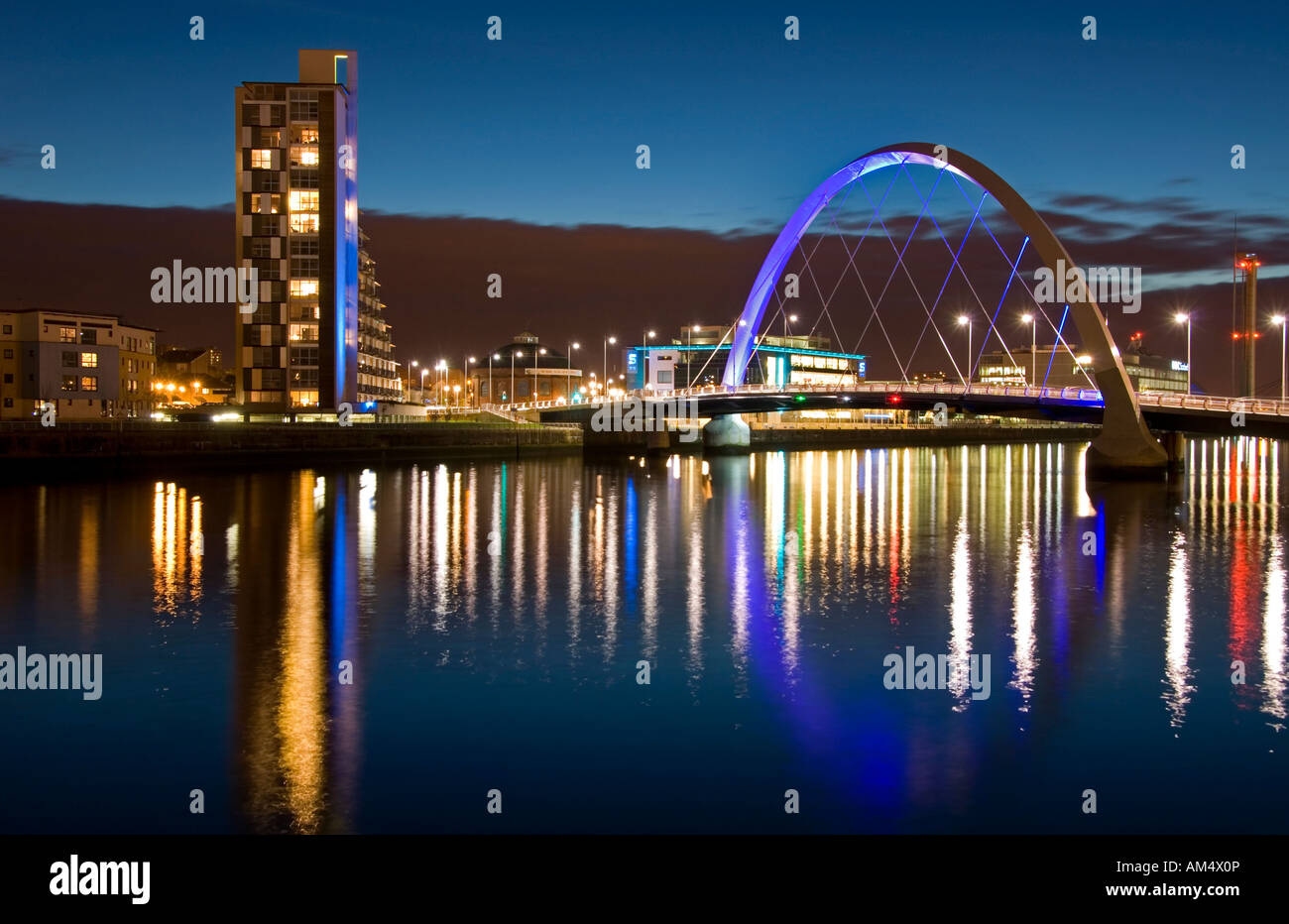 The River Clyde and Clyde Arc Millennium Bridge at Night, Glasgow, UK Stock Photo