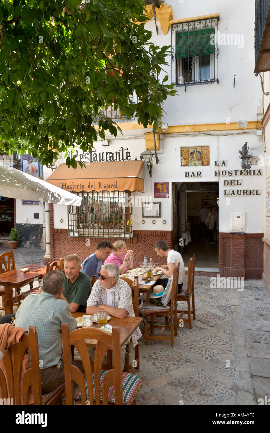 Restaurant at lunchtime, Plaza de los Venerables, Barrio de Santa Cruz, Seville, Andalucia, Spain Stock Photo
