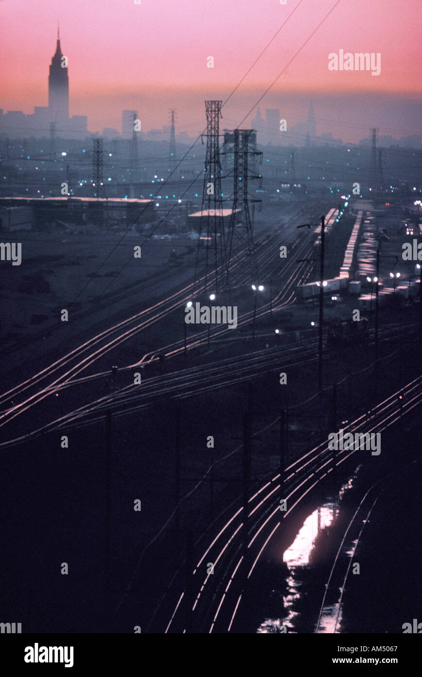 Looking east across train tracks in New Jersey toward New York at dawn Stock Photo
