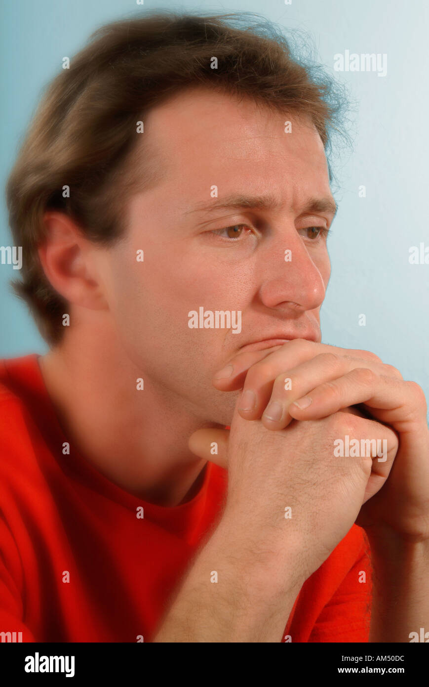 A man looking pensive stressed and worried Stock Photo