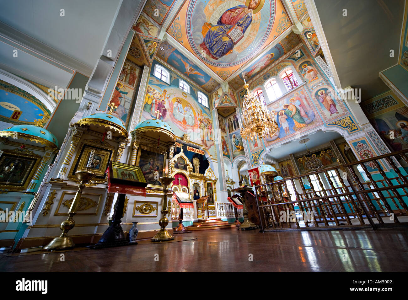 Church interior Almaty Kazakhstan. Main Altar, Iconostasis, ornaments and painted ceiling in Saint Nicholas Cathedral. Stock Photo