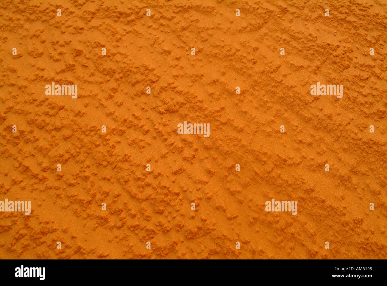 red or salmon colored sand pattern for backgrounds Stock Photo - Alamy