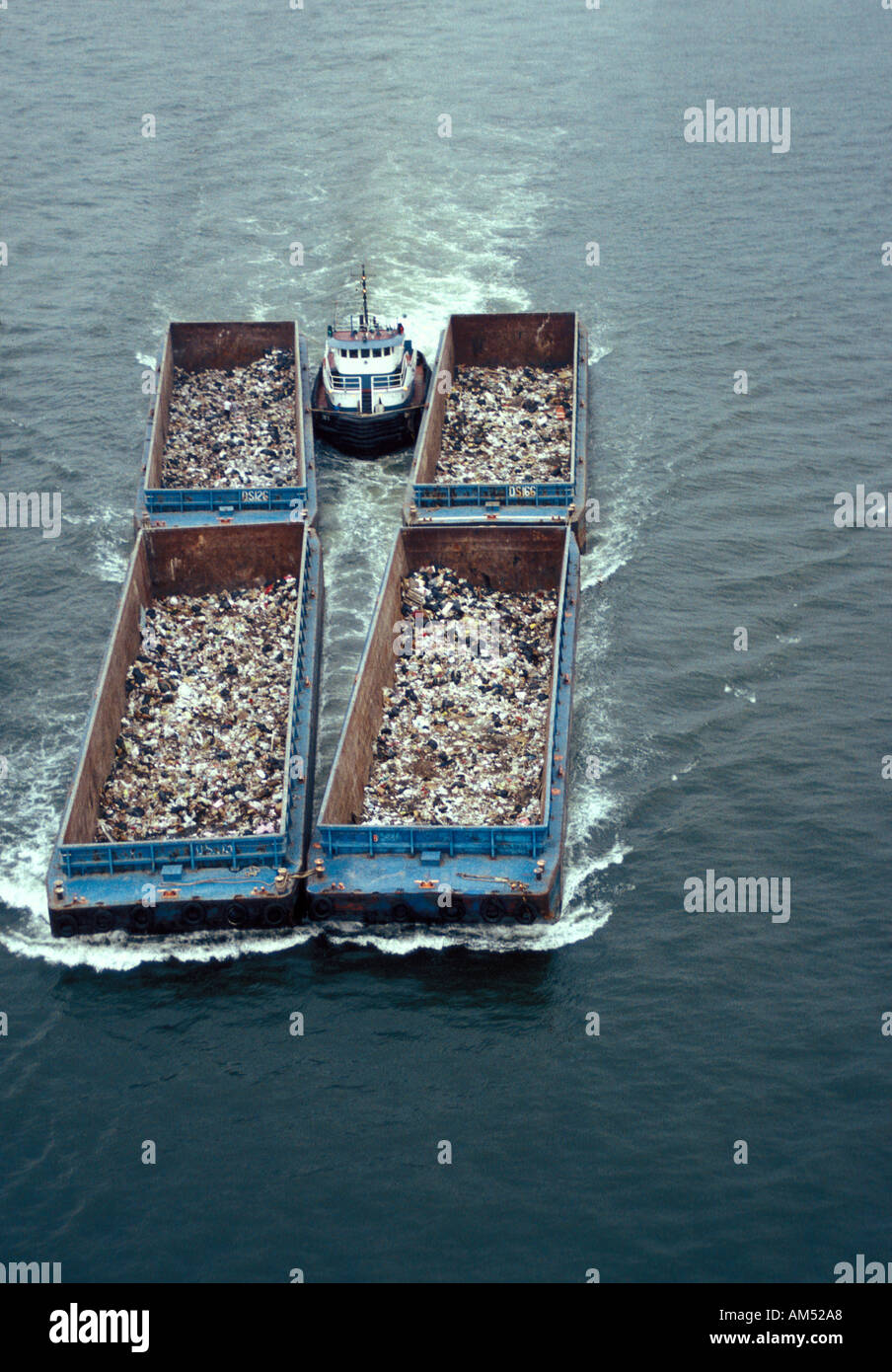 tug boat pushes garbage barges or scows Stock Photo 1331879 Alamy