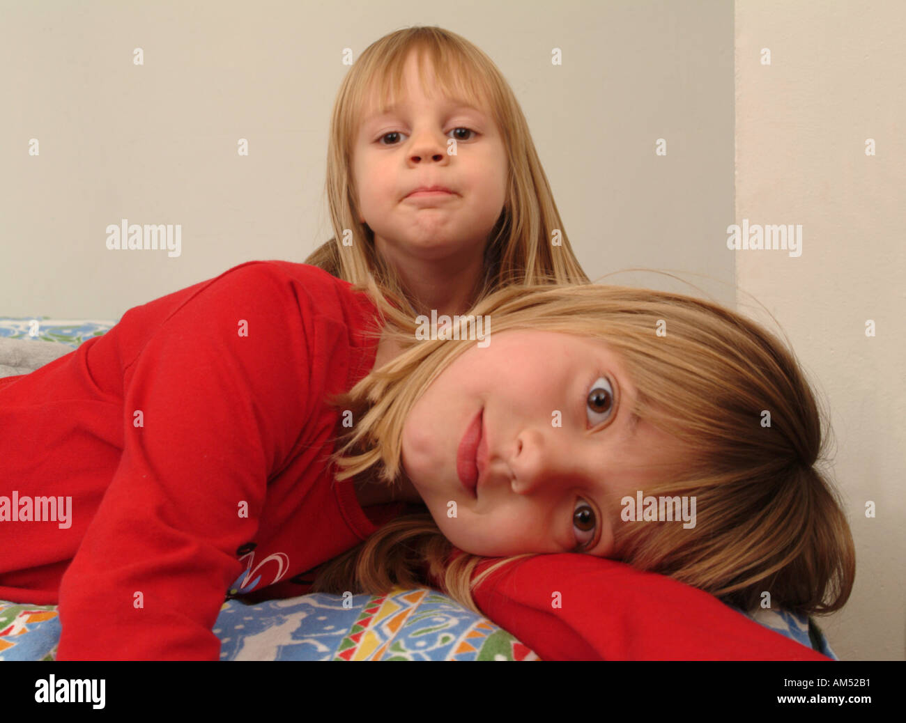 two girls who are best friends playing in their room Stock Photo