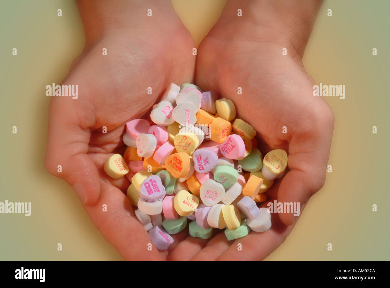 handful of heart shaped Valentine candy Stock Photo