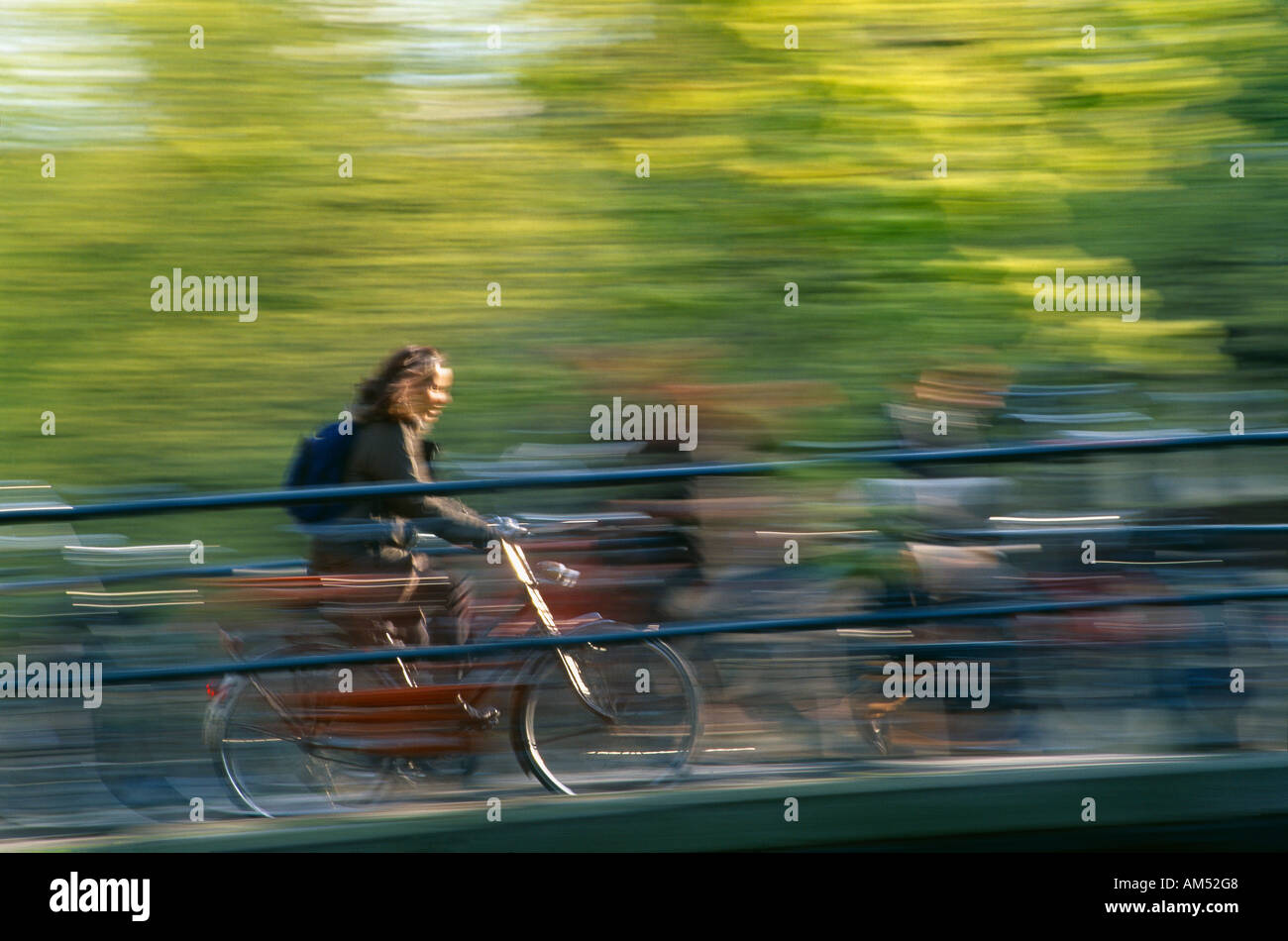 Cyclist canal amsterdam netherlands hi-res stock photography and 