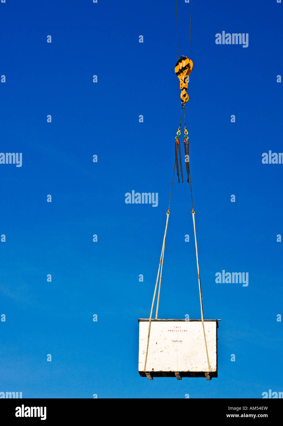 Crane hoisting load Stock Photo Alamy