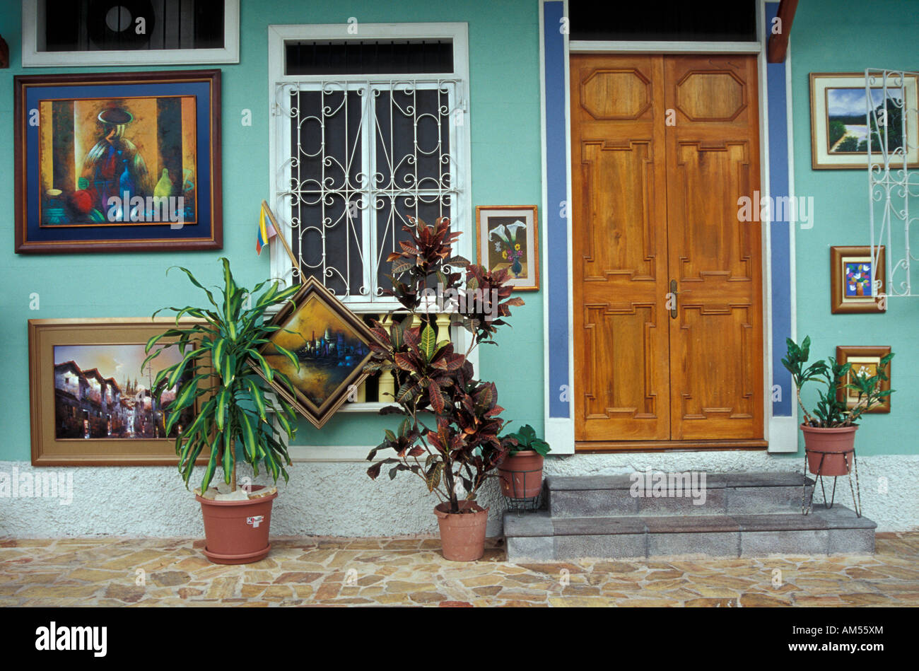Paintings for sale outside a restored house in the Las Peñas historic