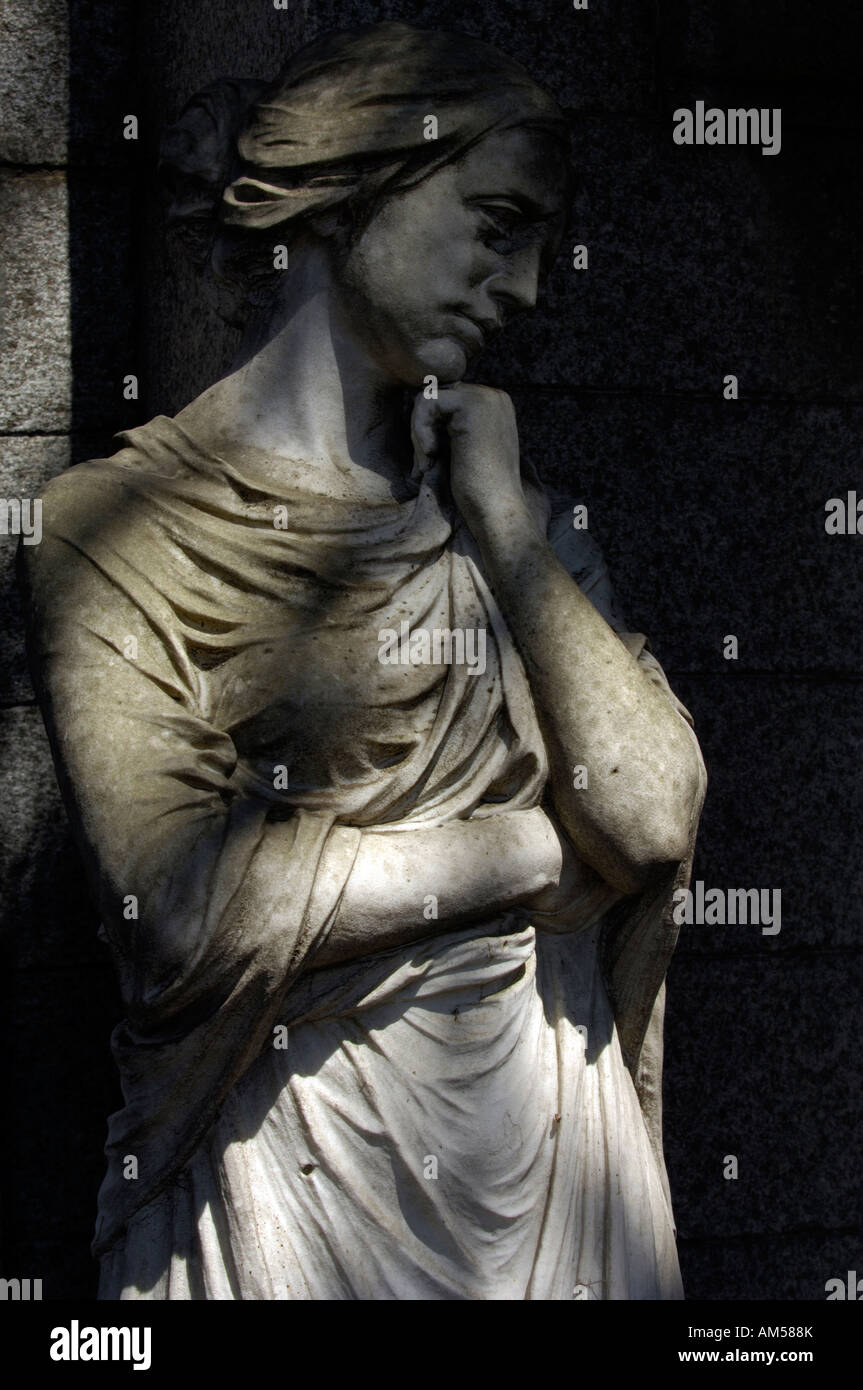 A statue of a grieving woman in Recoleta Cemetery in Buenos Aires Stock Photo