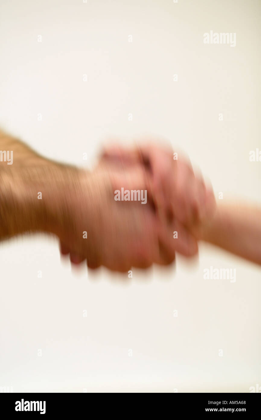 Man and woman shaking hands on white background Stock Photo
