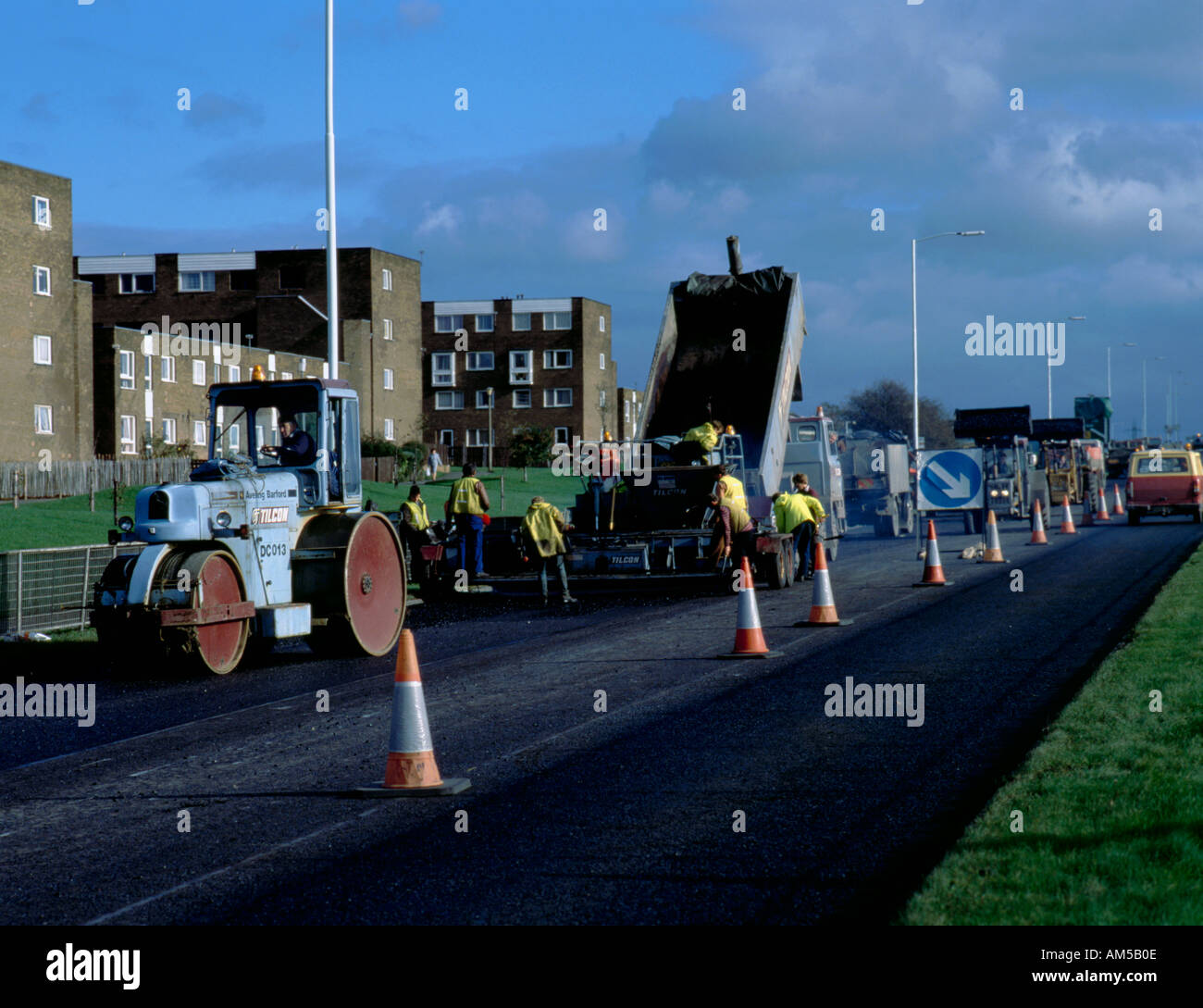 Road surfacing gang at work; on the Coast Road, Newcastle upon Tyne, Tyne and Wear, England, UK. Stock Photo