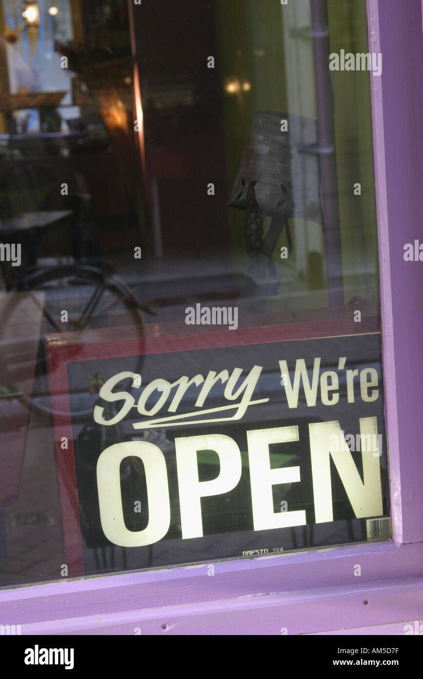 Humorous sign Sorry We Are Open in Amsterdam Holland Stock Photo