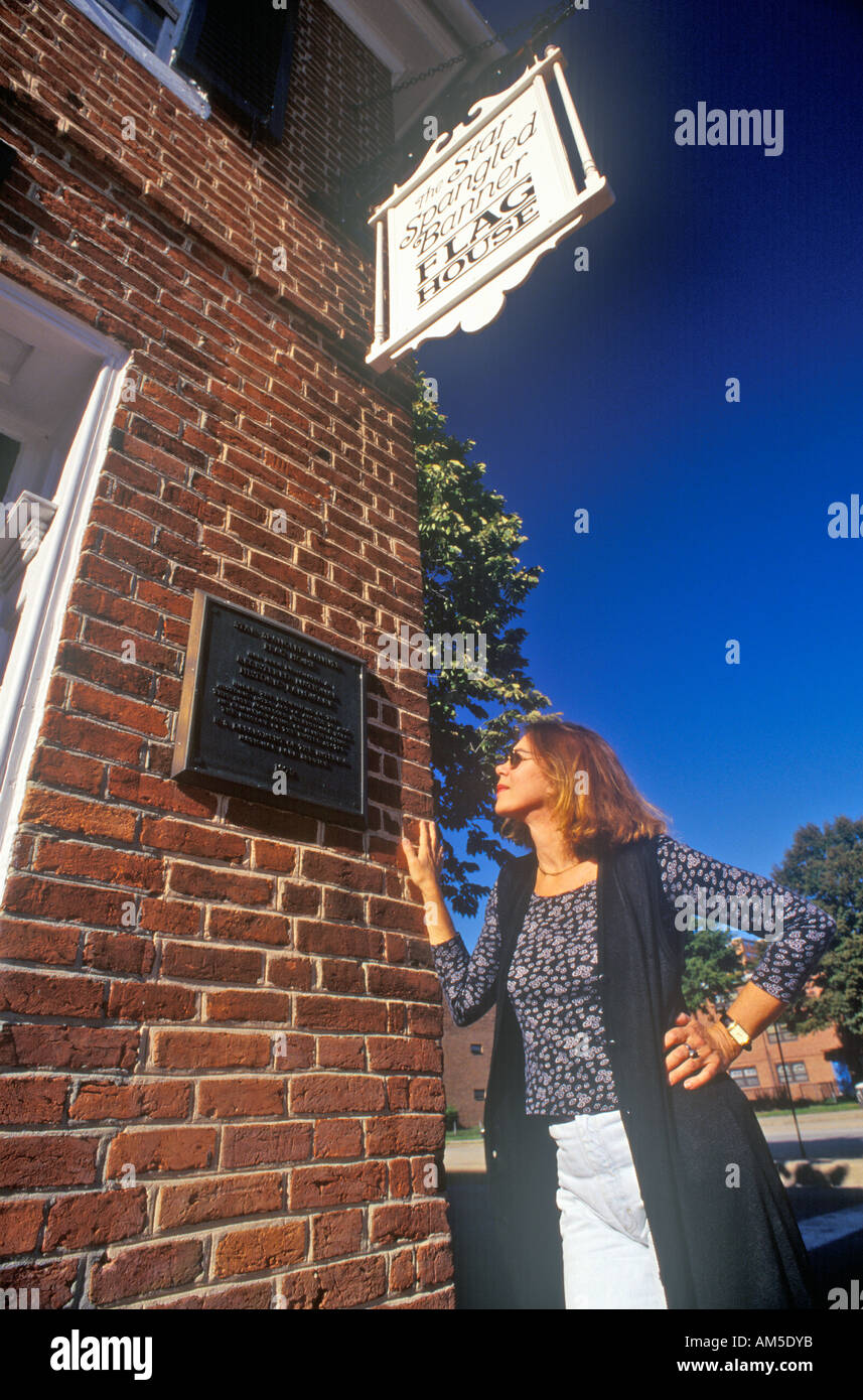 Woman Reading Plaque on Star Spangled Banner Flag House Baltimore Maryland Stock Photo