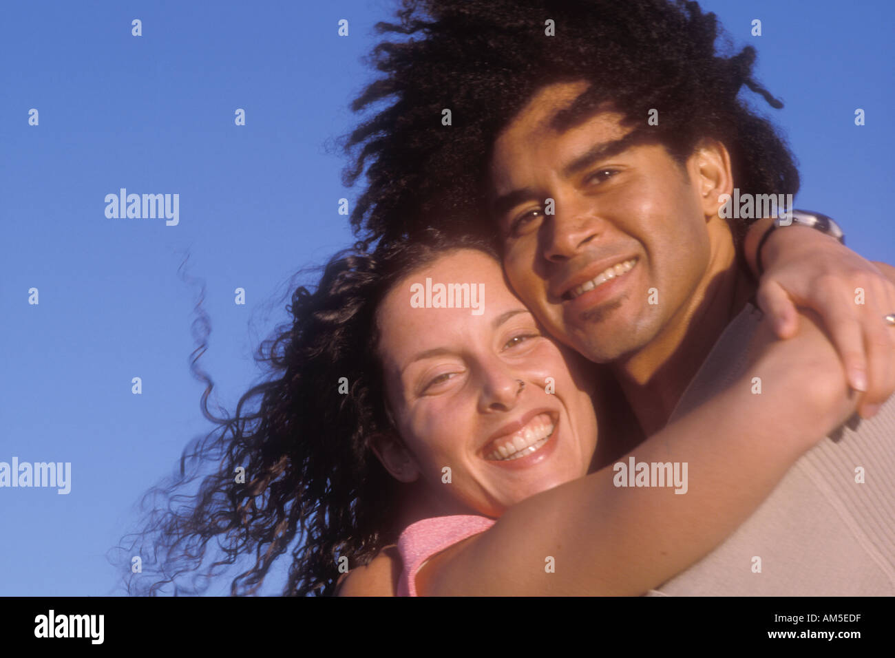 portrait of couple laughing 34 yr old mixed African Caucasian male and 27 yr old Caucasian female Stock Photo