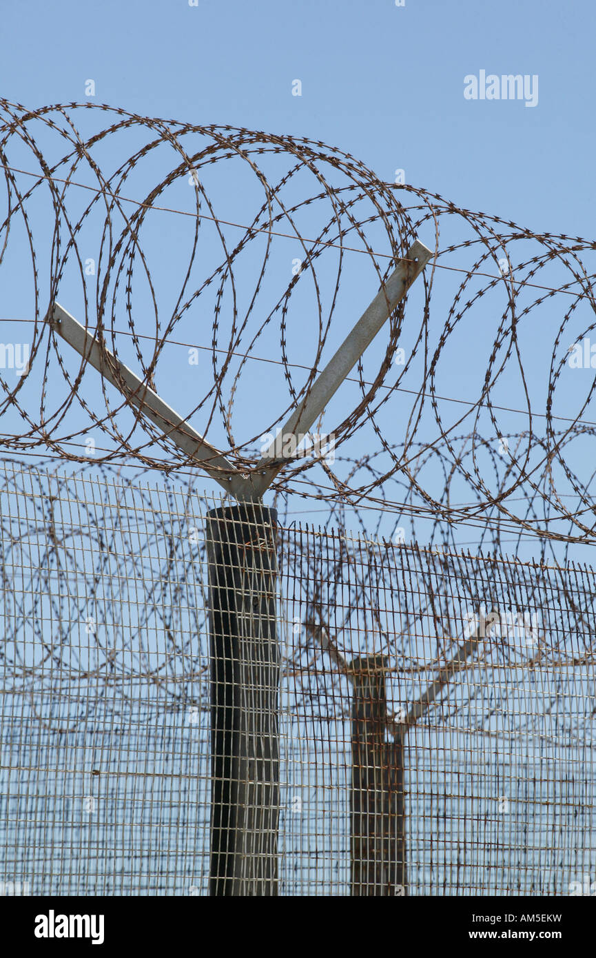 Barbed wire fence around the formerly prison on Robben Island, Cape Town, South Africa Stock Photo