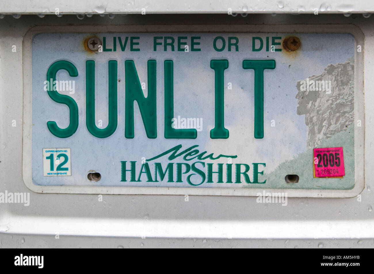 A New Hampshire license plate reads SUNLIT Stock Photo