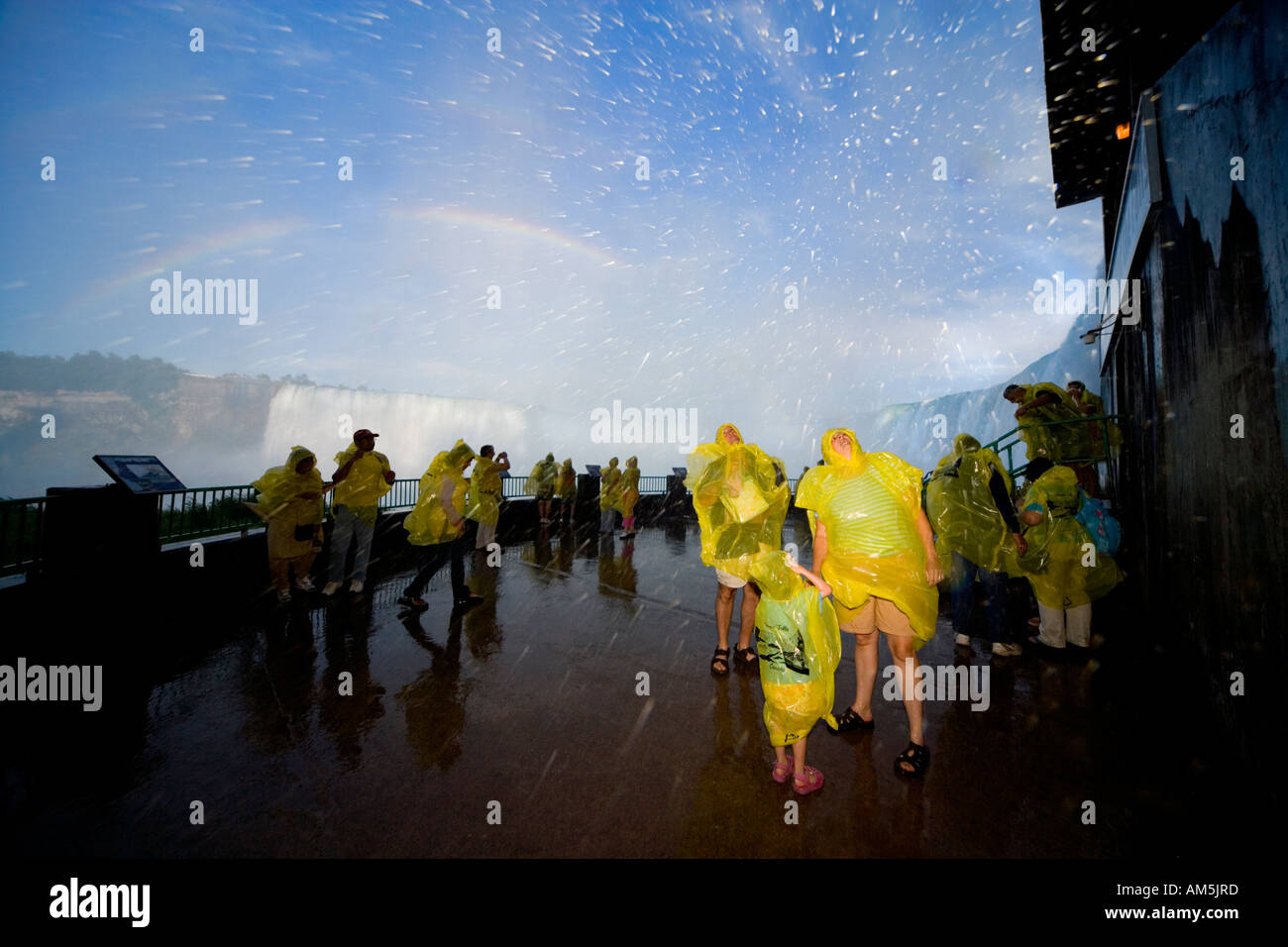 Tourists getting wet at Niagara Falls. Horseshoe Falls. Journey Behind the Falls on the Canadian side. Stock Photo