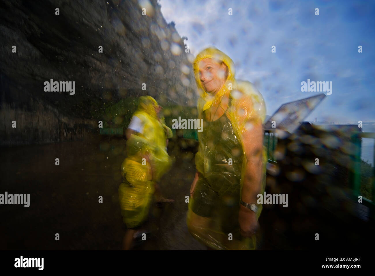 Tourist getting wet at Niagara Falls. Horseshoe Falls. Journey Behind the Falls on the Canadian side. Stock Photo