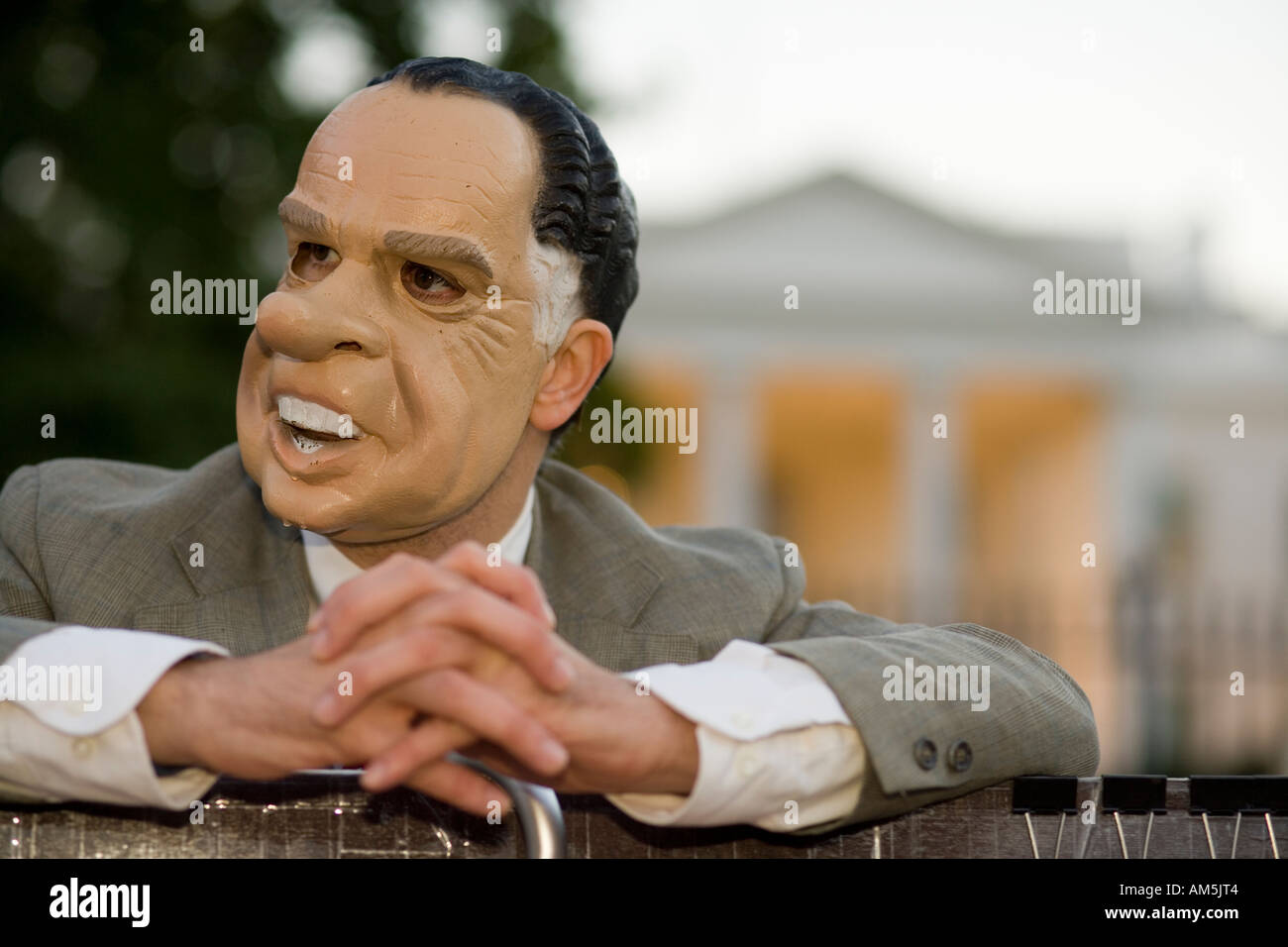 Man with Richard Nixon mask protesting the war in Iraq and the Bush administration in front of the White House Washington DC. Stock Photo