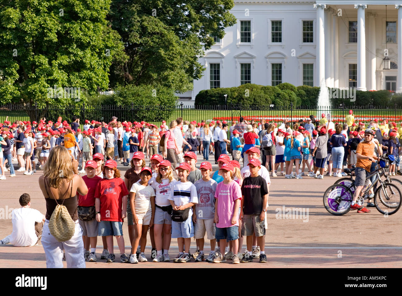 Young students take photo's of The White House Washington DC. View from Lafayette Park with The White House in the background. Stock Photo