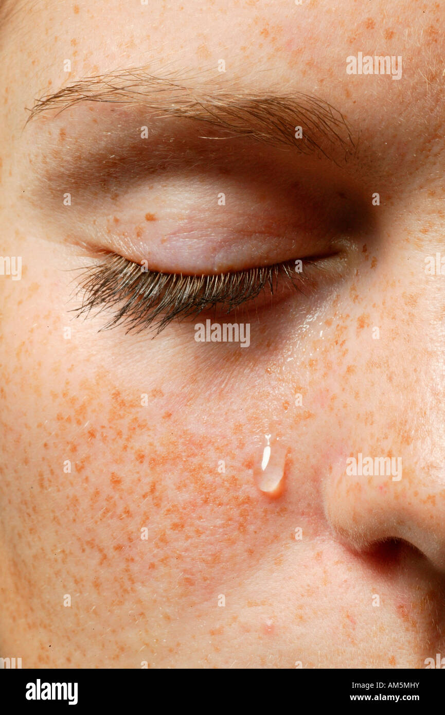 Eye with a teardrop Stock Photo Alamy