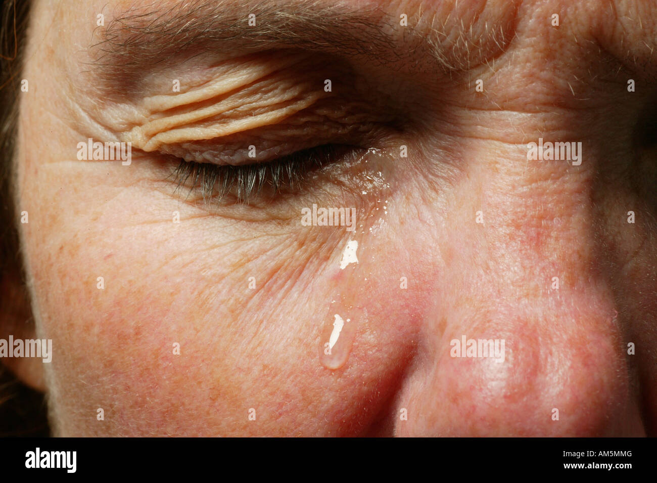 Eye with a teardrop Stock Photo Alamy