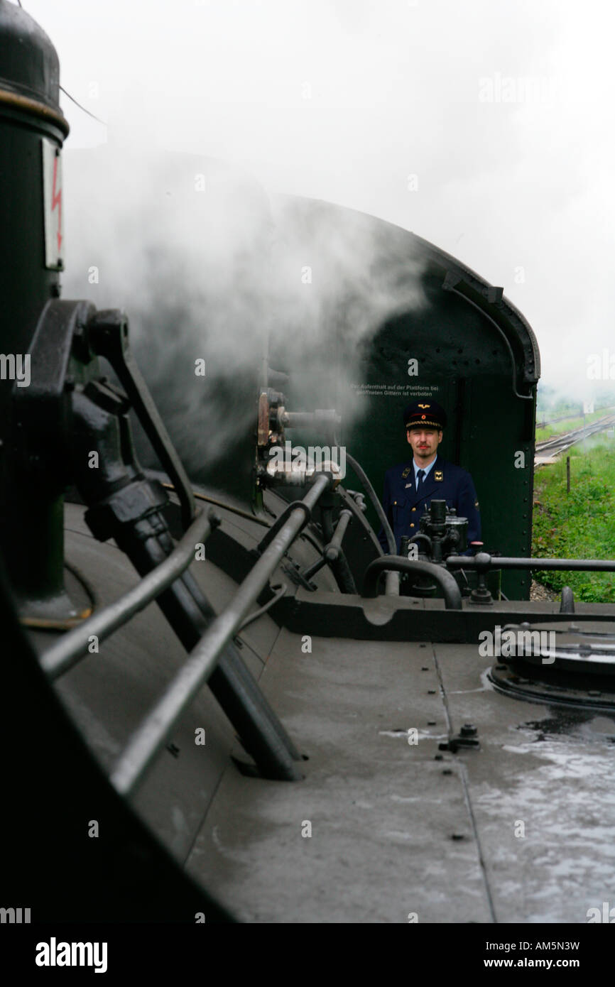 Historical steam train, view of the carriage with conductor Stock Photo