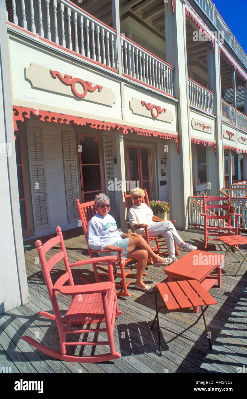 Rocking chairs on porch of Victorian home Sea Mist Apartments in Cape