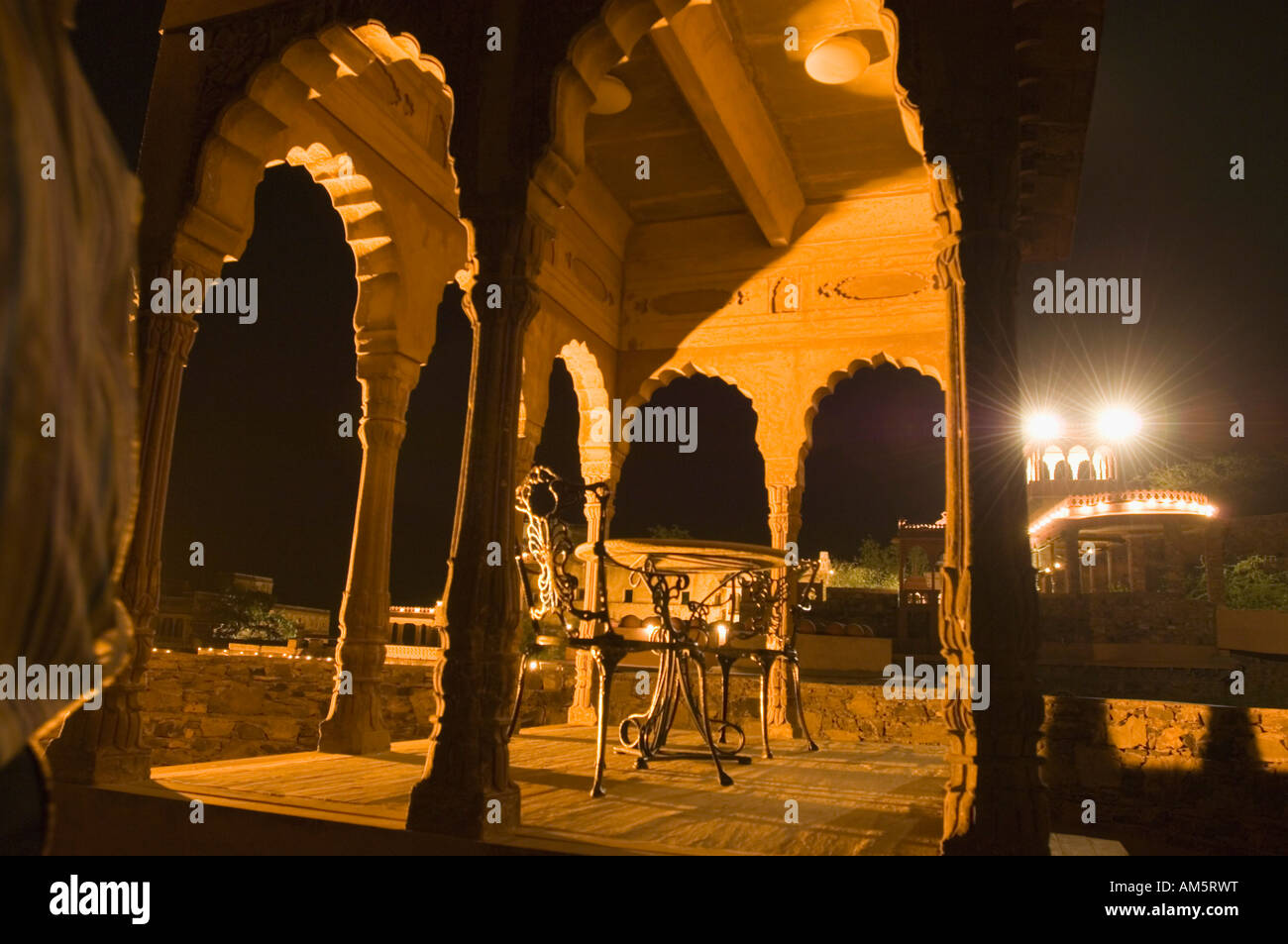 Two iron chairs in a fort at night, Neemrana Fort, Alwar, Rajasthan, India Stock Photo