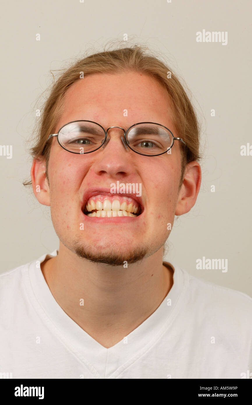 Teenager showing teeth Stock Photo