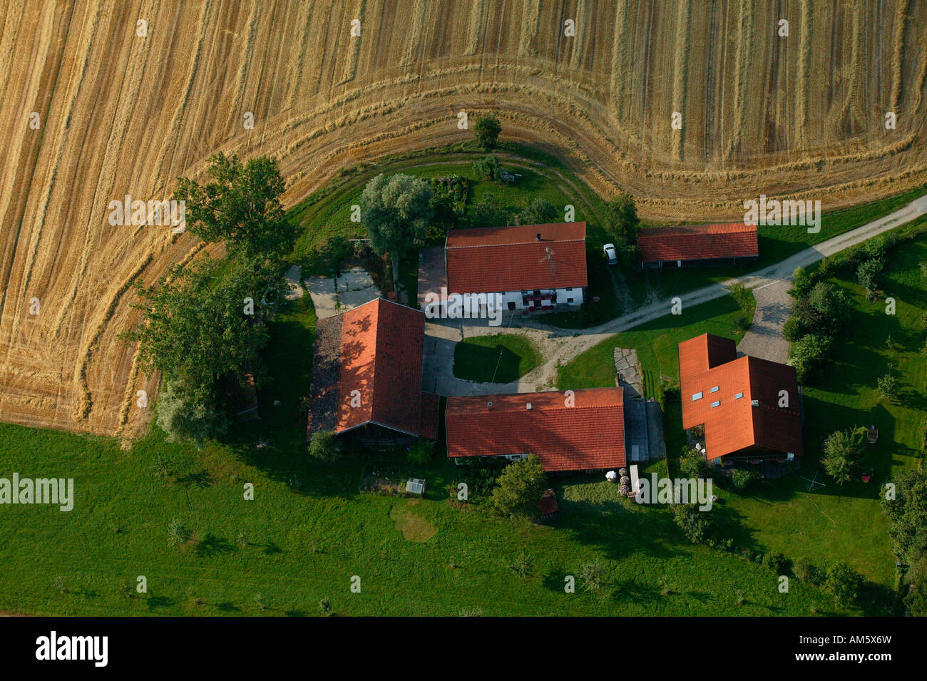 Farm between harvested grainfields, Lower Bavaria, Bavaria, Germany ...