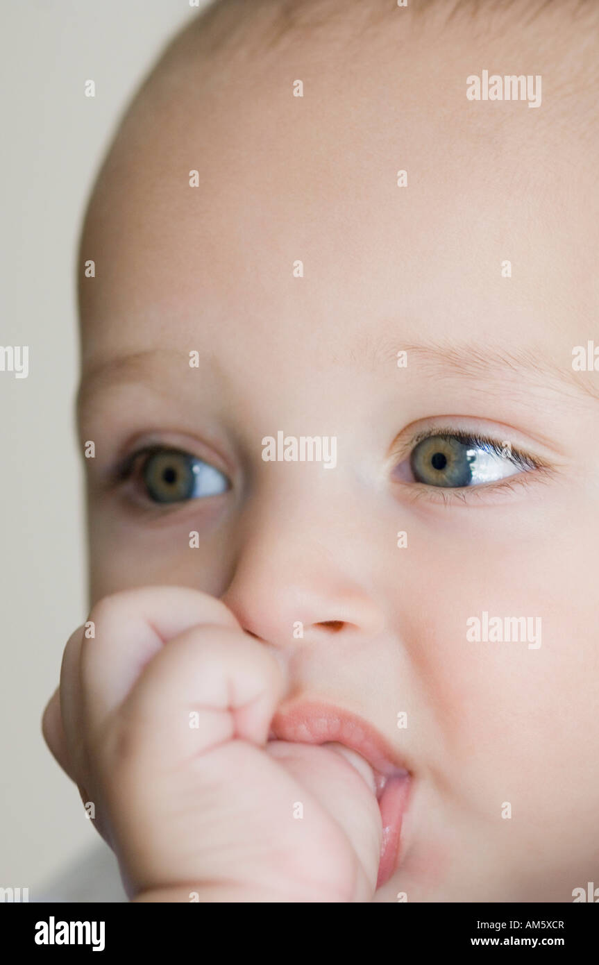 Close-up of a baby boy thumb sucking Stock Photo