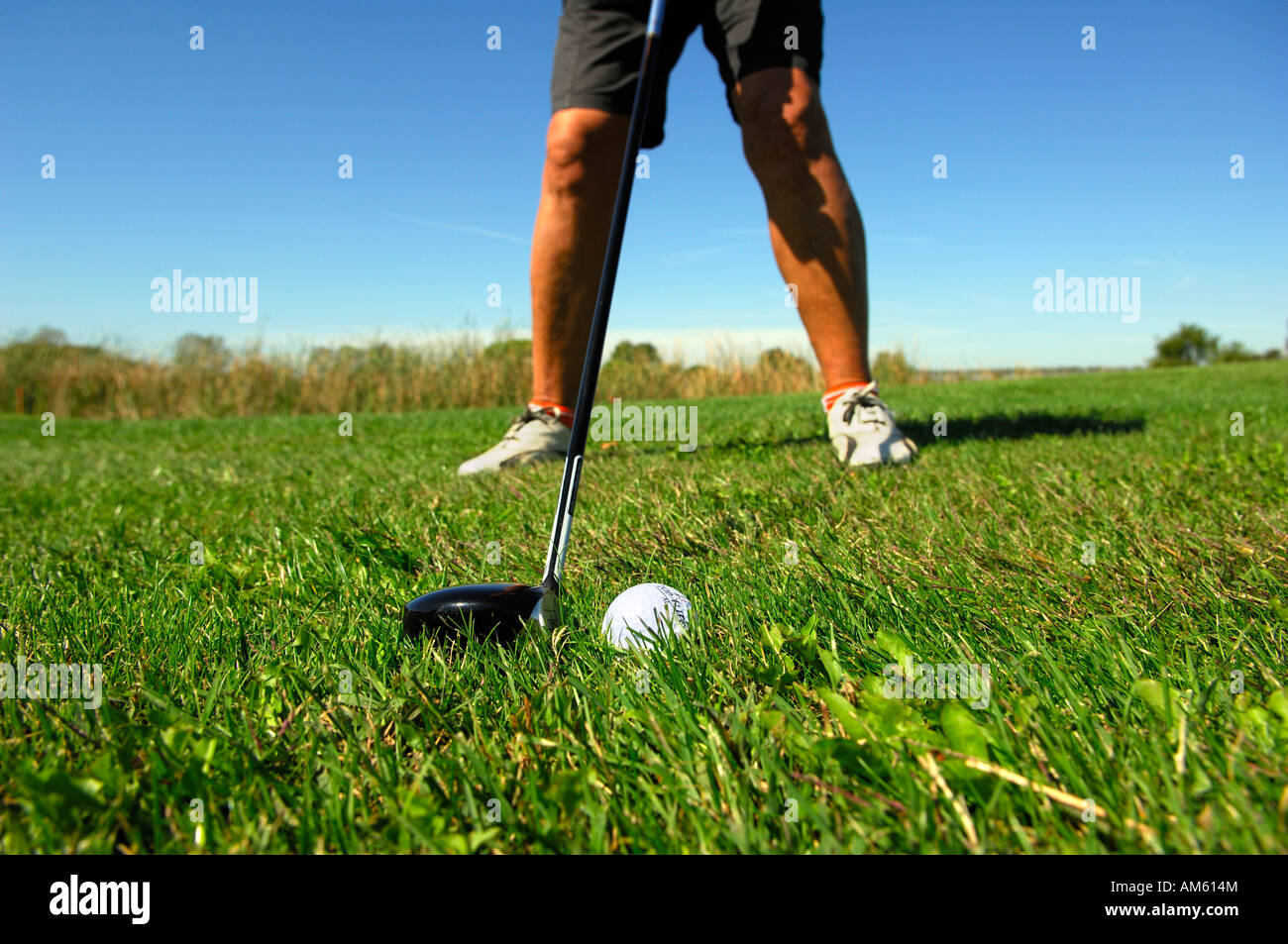 Golferduring a hit at the fairway, golf course, Caorle, Veneto, Italy Stock Photo