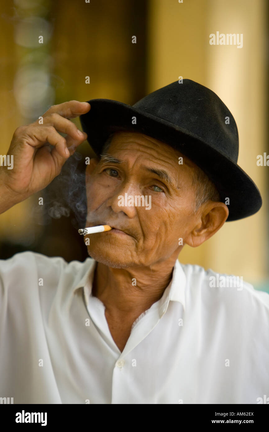 Old vietnamese man smoking a cigarette, Mekong Delta, Vietnam Stock ...