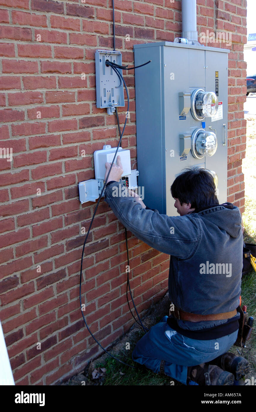 tech installing telephone and service into