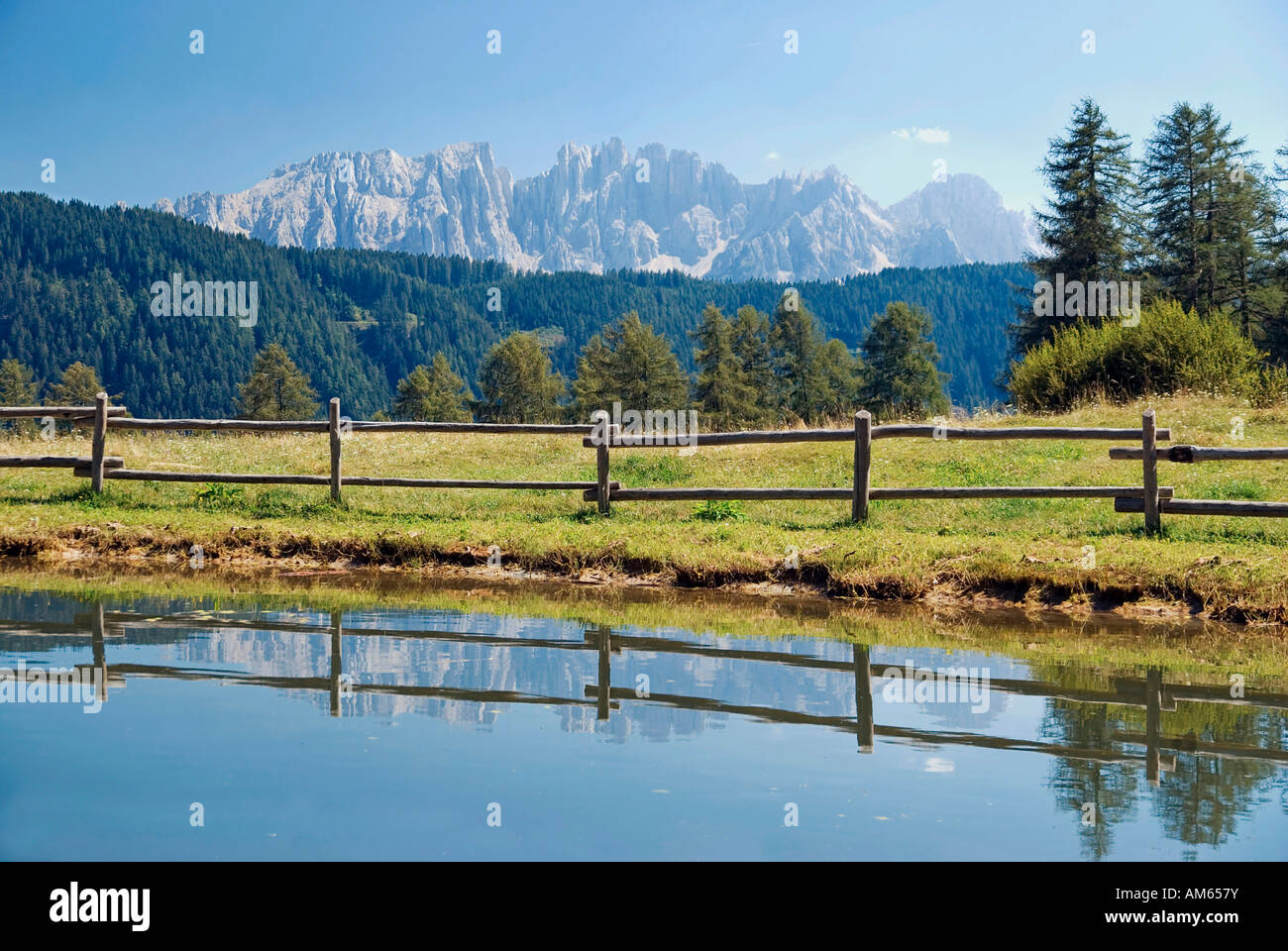 Reflection of the Latemar massif near Tiers, South Tyrol, Italy Stock Photo