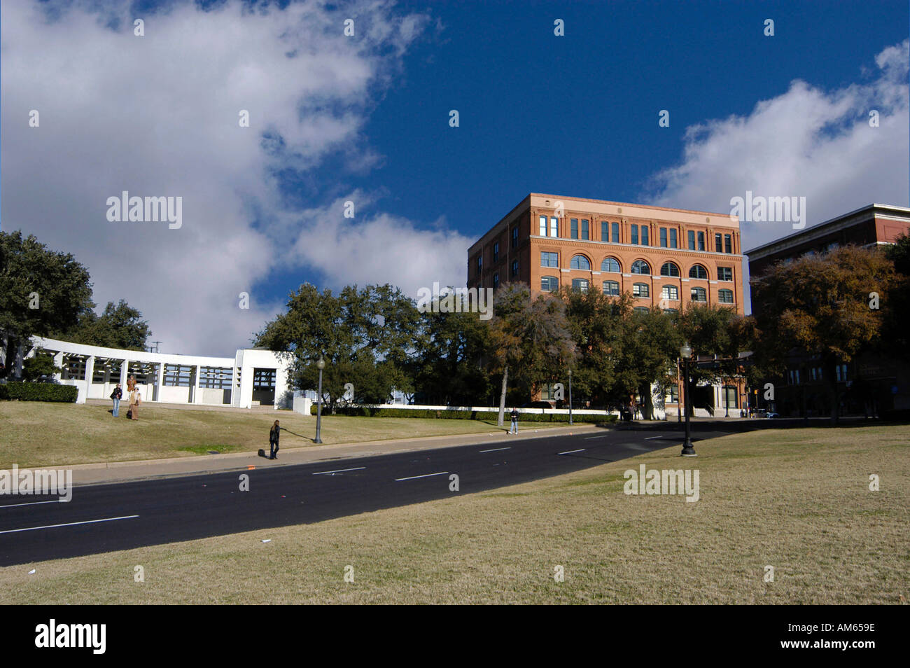 Wide angle view of Dealy Plaza and Kennedy assassination site with Book Repository and grassy knoll Stock Photo