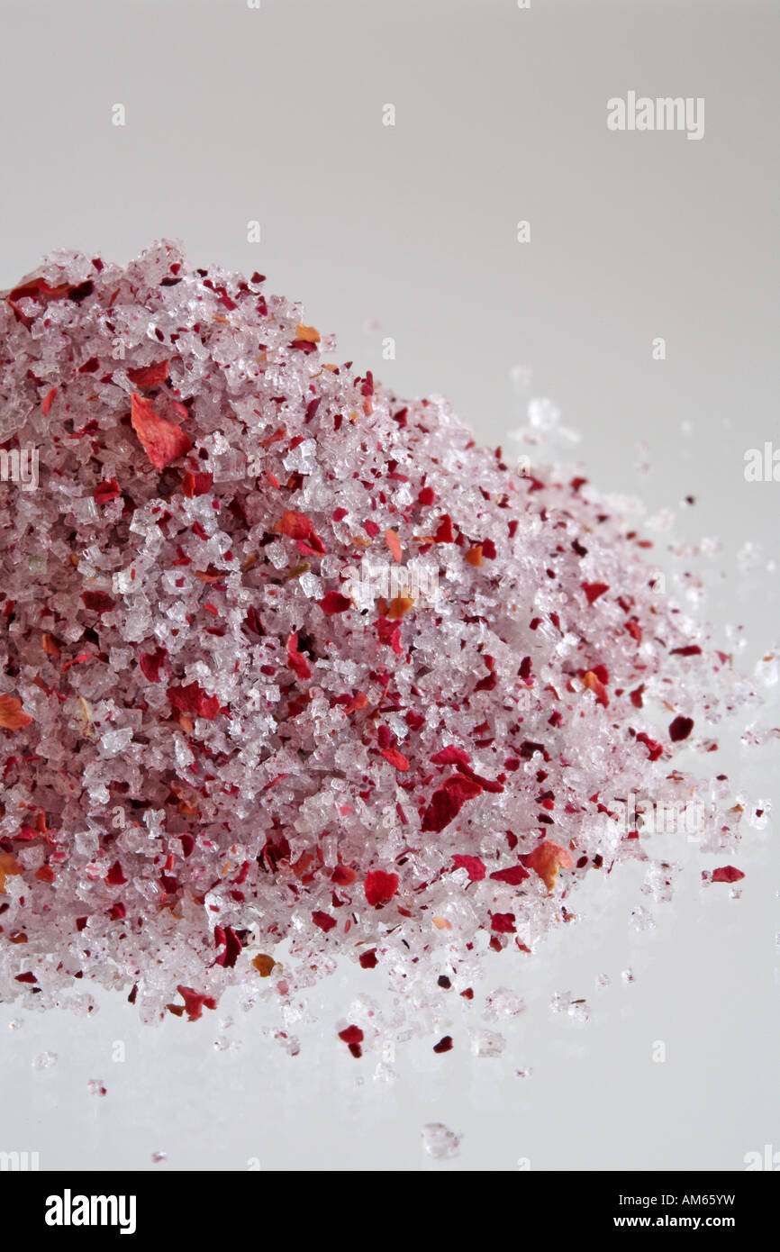 Sea salt with rose blossoms Stock Photo