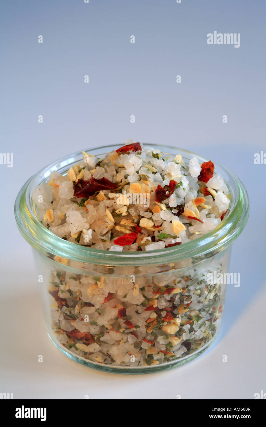 Colourful sea salt, mixture with chili, paprika, oregano, basil, garlic, onions and pepper Stock Photo