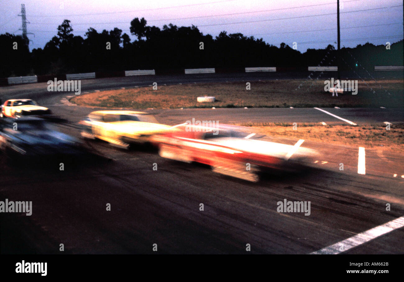 Motion shot of three cars in stock car race Stock Photo